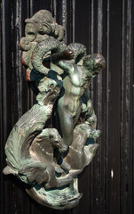 Fascinating art installation on one of the entrance doors to the historic Villa Monastero, the villa of lords, Varenna, Province of Lecco, Italy.