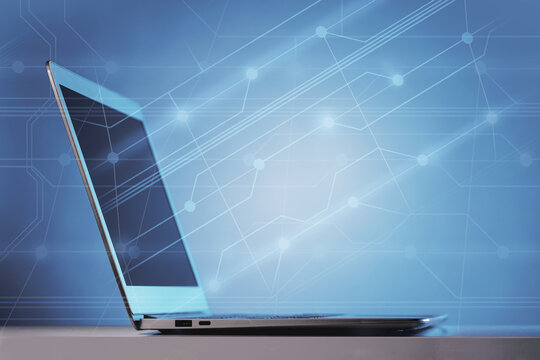 Side view of laptop on desk in neon lights cyberpunk futuristic background. Copy space. Communications advanced technology apps, music podcasts IT development chip board. Circuit flow