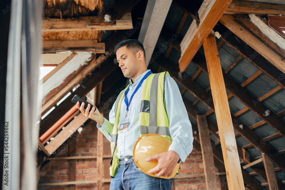 Poster Building, engineering and construction worker with phone in hand texting, typing and online. Technology, construction and architect, engineer or contractor in building site on internet on smartphone