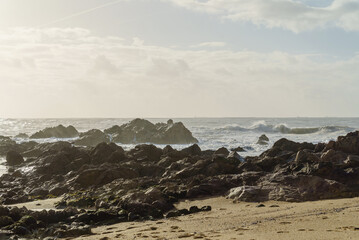 Rocks of Atlantic Ocean seen from beach in Porto, Portugal