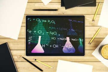 Creative chemistry hologram on modern digital tablet screen, pharmaceutical research concept. Top...