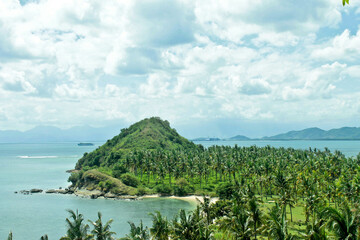 expanse of coconut groves and hills with beautiful beaches