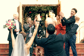 Wedding, applause and couple holding hands in celebration with support from clapping guests,...