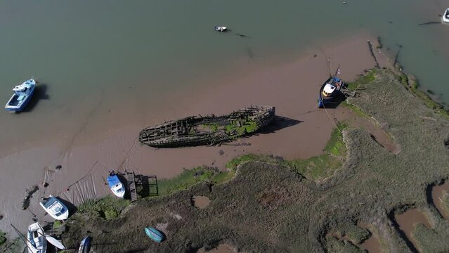 Aerial View Of A Shipwreck Dock Near Salt Marshes In Tollesbury Marina, Essex, UK.
