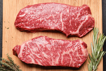 Prime marbled beef steaks. Raw striploin steak