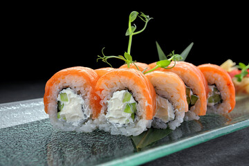 Sushi roll Philadelphia on a dark background