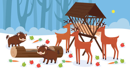 Obraz premium Small deer in the winter in the forest near the feeder and small wild boars near the tree trunk