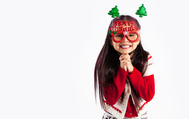 Little asian kid in red sweatshirt Christmas theme fancy costume posing on white background.