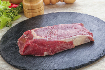 Raw rib-eye beef steak black angus