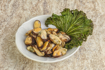 Tasty marinated mussels in the bowl