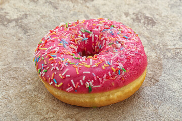 Sweet glazed struwberry donut with icing