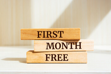 Wooden blocks with words 'First month free'.