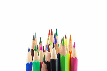 A set of colored pencils on white background