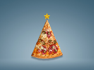 Christmas offer pizza slice in shape of Christmas tree isolated on sky blue background. Creative...