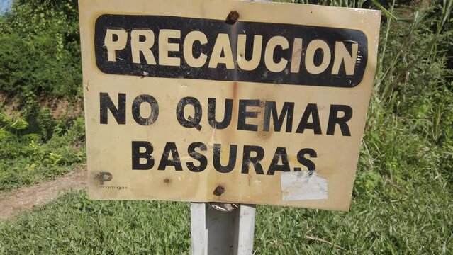 Colombia 2022 sign with the words do not burn garbage, no quemar basura in  South American country with high environmental pollution and CO2 emissions in the air - Climate change and global warming 