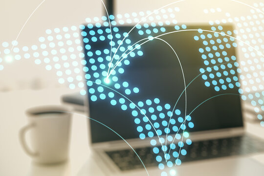 Abstract creative world map with connections on modern laptop background, international trading concept. Multiexposure