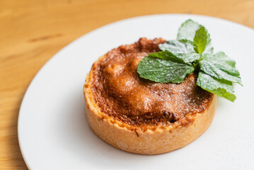 tartlets pastries with almond frangipane and powdered sugar