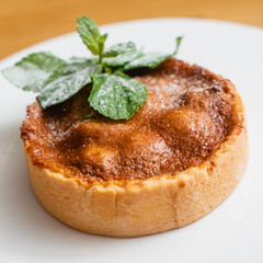 tartlets pastries with almond frangipane and powdered sugar