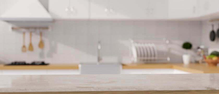 Empty mockup space on modern kitchen tabletop over blurred minimal Scandinavian kitchen