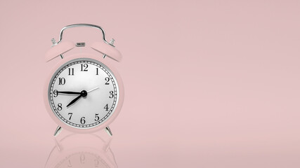 retro alarm clock in pastel pink on a pastel background with space for any text