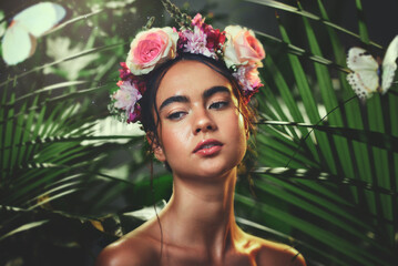 Beauty, nature and crown flower on woman in nature jungle for skincare, health and wellness with...