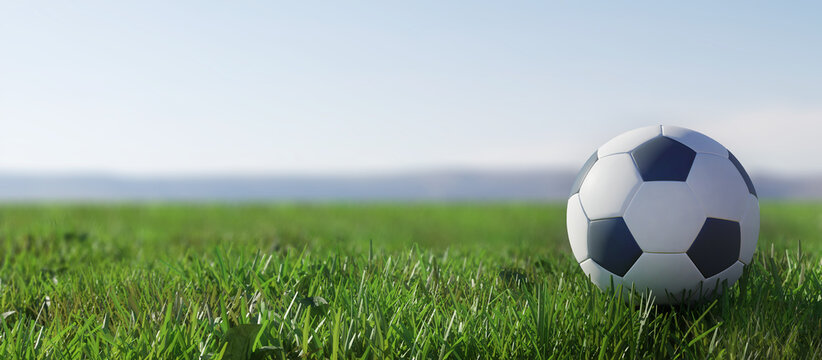 Ball on the football field. Soccer ball green grass.