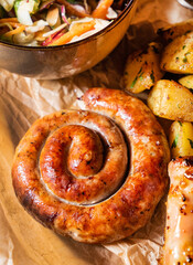 sausages with baked potato and salad