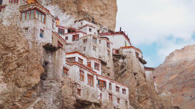 4K closeup shot of Phugtal Monastery made in a natural cave near Purne village in Zanskar, Ladakh India. Ancient monastery in a cave more than 2550 years ago in India. Monastery built inside the cave.