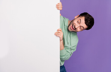 Photo portrait of handsome young man look excited impressed white wall wear trendy gray garment...