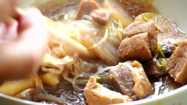 Braised pork soup with vermicelli , in door Chiangmai Thailand.