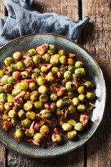 Bowl of Brussels sprouts, roasted with bacon and chestnuts. Perfect for a Christmas sidedish