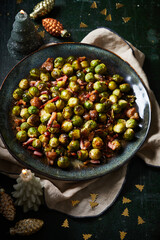 Bowl of Brussels sprouts with chestnuts and bacon, roasted in the oven
