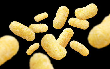 Flying corn sticks, isolated on black background