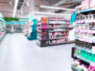 Abstract blur image of supermarket background. Defocused shelves with products. Grocery store. Retail industry. Rack. Discount. Inflation concept. Aisle. Consumer packaged goods. CPG. Shopping. Market