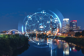 Panoramic view of Broadway district of Nashville over Cumberland River at illuminated night skyline, Tennessee, USA. Social media icons. The concept of networking and establishing people connections