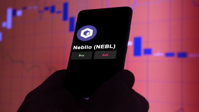 November 3th 2022, Berlin. An investor's analyzing the Neblio token 'NEBL' coin on screen. A phone shows the crypto's prices to invest