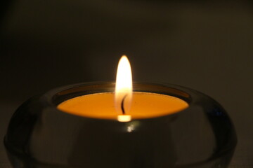 burning candle in the dark