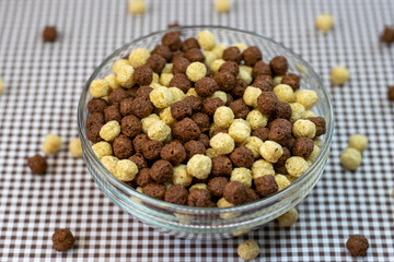 Bowl of brown cereal on the table