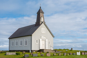 Fototapeta na wymiar Strandarkirkja church in Selvogur on southern Iceland. This is a famous church often called the miracle church due a miracle saving of sailors in the 12th century.