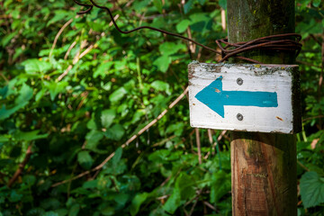 Uriage les Bains France 11 2022 directional sign with a blue arrow