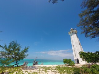 One of the corners of the island of lanjukang with a view of the white lighthouse overlooking the...