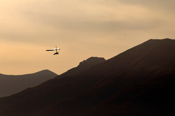 hang glider against the sky - 544318472