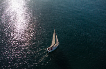lonely sailing yacht in the sea top view