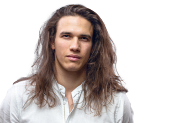 Handsome calm man. Portrait of a young muscular guy with long hair. Strong boy on an isolated white background in the studio
