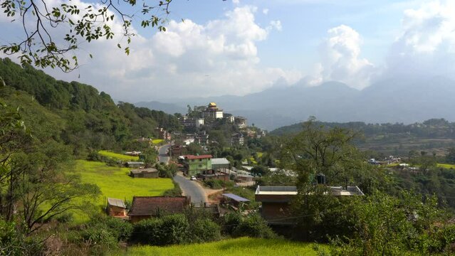 A view of the Neydo Tashi Choling Monastery in the small town of Dakshinkali in Nepal surrounded with mustard fields.