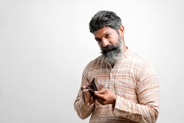 Indian farmer showing empty wallet on white background.