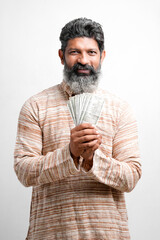 Young Indian farmer posing with currency on white background.