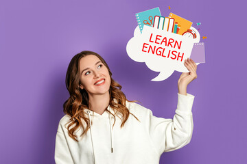 student girl holding speech bubble with text learn english and illustration isolated on lilac...