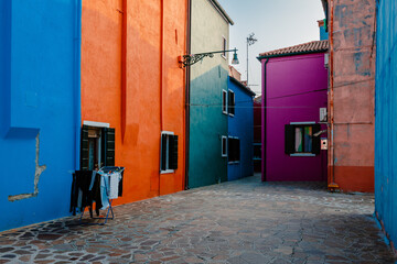 Alley with typical colorful houses in Burano