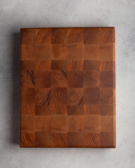 Wooden cutting board in the kitchen on a light background